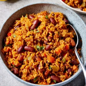 Vegan Spanish rice and beans dish served in a colorful bowl