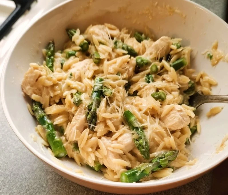 High protein chicken orzo dish served with fresh herbs and vegetables